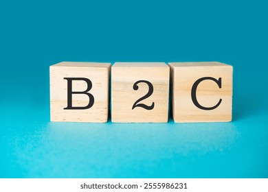 Three wooden blocks spell out the word B2C. The blocks are arranged in a way that they spell out the word, with the first block on the left, the second block in the middle - Powered by Shutterstock