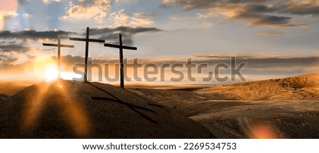 Three wooden crosses on a hill in the morning. Concept of Crucifixion on Mount Golgotha, resurrection of Jesus Christ. Christian Easter holiday symbol, Calvary.