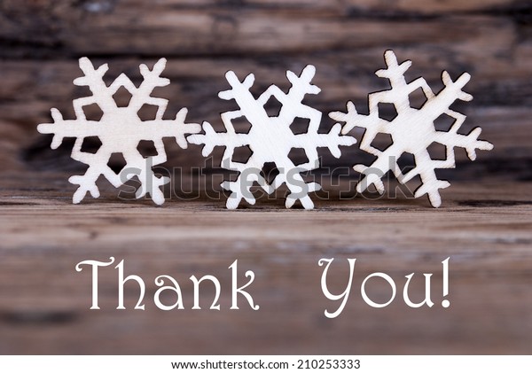 Three Wooden Snowflakes with the Words Thank You