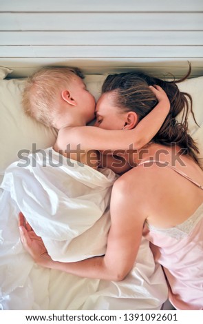 Similar – Little girl playing with boy over the bed