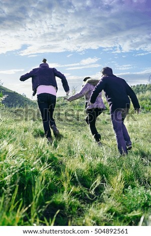 Similar – Image, Stock Photo Young couple taking a walk near the coast