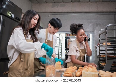 Three Young Friends And Startup Partners Of Bread Dough And Pastry Foods Busy With Homemade Baking Jobs While Cooking Orders Online, Packing, And Delivering On Bakery Shop, Small Business Entrepreneur