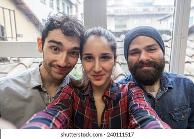 Three Young Friends Take A Selfie From The Office