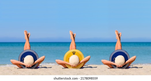 Three Young Girls On The Beach Wearing Straw Hats In The Colors Of The Flag Of Barbados. The Concept Of The Perfect Holiday In The Resorts Of The Barbados. Focus On Hats.