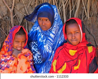 Three Young Girls With Traditional Dresses In The Somali Region Of Eastern Ethiopia