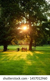 Three Young Men Sitting On Bench Stock Photo 1457012960 | Shutterstock