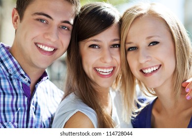 Three Young People Smiling