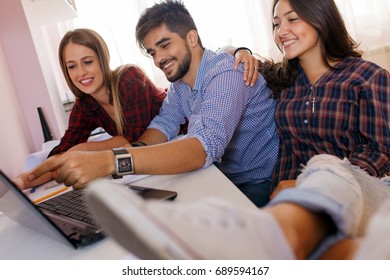 Three young students working together on a new project.