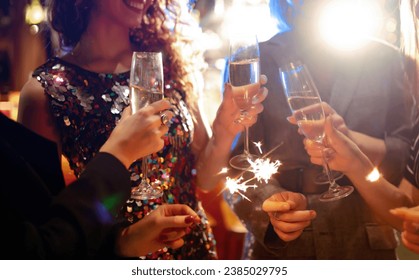 Three young Woman with champagne glasses at night club. Women friends drinking champagne in the bar. - Powered by Shutterstock