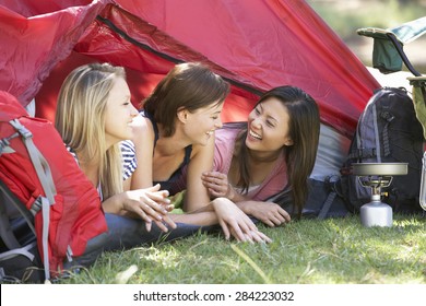 Three Young Women On Camping Holiday Together