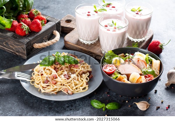 Three-course set menu for a\
nutritious healthy lunch. Three course set on a table in a business\
lunch, food set lunch. Full set of three dishes for lunch in a\
cafe