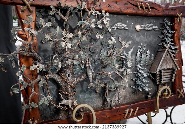 A three-dimensional picture, forged\
from metal, depicting the plots of folk tales. Steel figurines of\
fairy-tale characters forged by skilled\
blacksmiths.