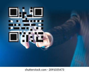 Three-dimensional QR code on a virtual screen. Person puts his hand to the QR code. Bar code about vaccination. Matrix QR on black background. Quick Response code.  A new reality.  - Powered by Shutterstock - Get 15% off with code: PIKWIZARD15