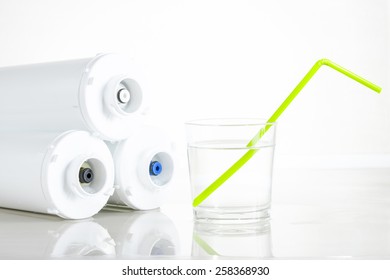 Three-level Cleaning Water Filters And Glass Of Water With Drinking Straw.