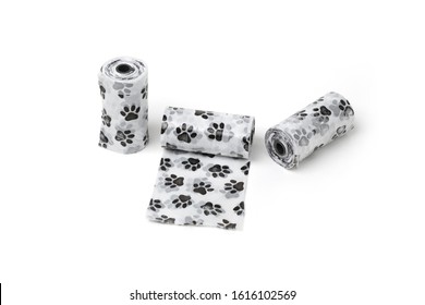 Three-piece disposable pets dog waste poop roll pochette and cute black-white paw printing. Isolated on the white background. Easy and fast to pick up poop. 