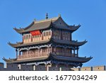Three-story east gate tower over Guanghua Lou-Enlightenment Gate Jiayuguan fortress-rammed soil wall with red plaque reading Tian Xia Di Yi Xiong Guan-First and Greatest Pass under Heaven. Gansu-China