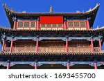Three-story east gate tower over Guanghua Lou-Enlightenment Gate Jiayuguan fortress-rammed soil wall with red plaque reading Tian Xia Di Yi Xiong Guan-First and Greatest Pass under Heaven. Gansu-China