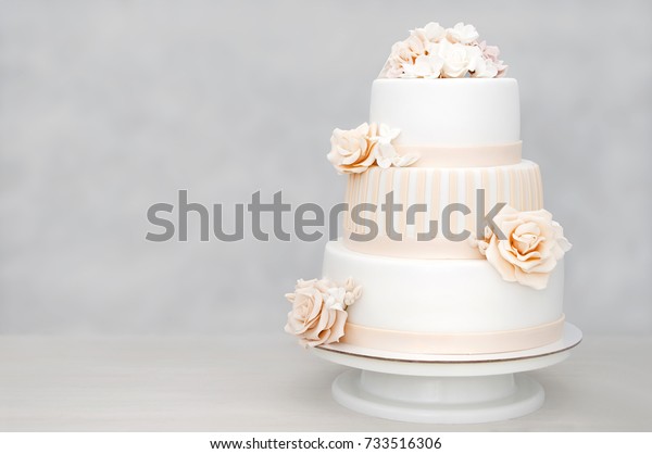 Threetiered White Wedding Cake Decorated Flowers Stock Photo Edit