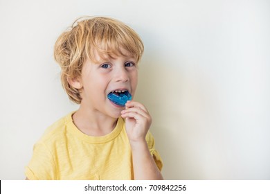 Three-year old boy shows myofunctional trainer to illuminate mouth breathing habit. Helps equalize the growing teeth and correct bite. Corrects the position of the tongue.