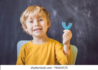 Three-year Old Boy Shows Myofunctional Trainer. Helps Equalize The Growing Teeth And Correct Bite, Develop Mouth Breathing Habit. Corrects The Position Of The Tongue.