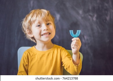 Three-year Old Boy Shows Myofunctional Trainer. Helps Equalize The Growing Teeth And Correct Bite, Develop Mouth Breathing Habit. Corrects The Position Of The Tongue.