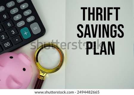 Thrift savings plan text message written on note page with calculator, piggy bank and magnifying glass