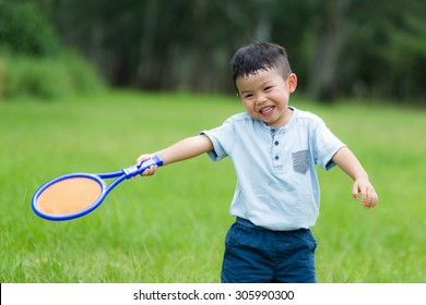 Thrilled Little Kid Play With Tennis