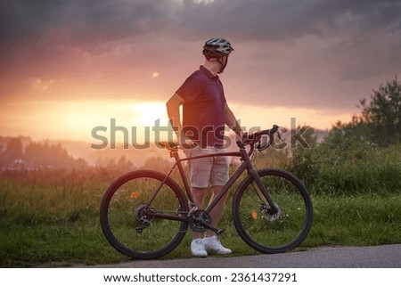 Thrilling Gravel Ride. Man in Action on a Bicycle. Outdoor Adventure. Cyclist Enjoying a Gravel Bike Ride in Nature [[stock_photo]] © 