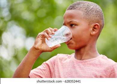 Thristy African Boy Drinks Water From Plastic Cup