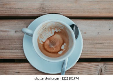 Thriving Economy - Consumer Empty Cup Of Coffee With Spoon On Table