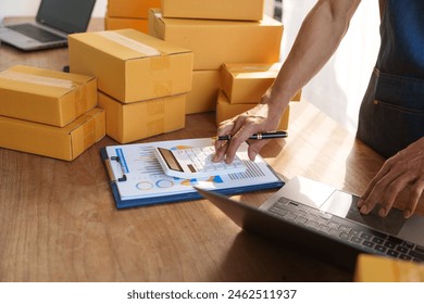 Thriving small businesses, often run by male freelancers, entrepreneurs, leverage e-commerce and logistics for online orders. home offices, manage packaging, shipping, client relations using laptops. - Powered by Shutterstock