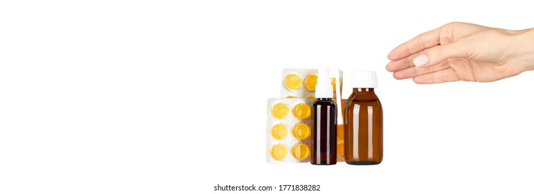 Throat ache pills in bister, spray and syrup with hand, isolated on white background. Copy space template, banner. - Shutterstock ID 1771838282