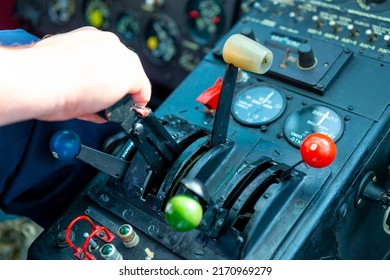 Throttle Lever In Selective Focus In The Cockpit Of A Vintage Plane,  Biplane To Throttle Engine Power During Takeoff Or Landing. Instruments Are Labeled 