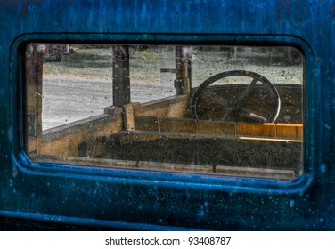 Through The Back Window - View Of Interior Of Old Blue Truck With Wooden Interior