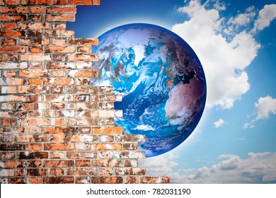 Through a cracked wall you can see the world - freedom concept image
- Photo composition with elements furnished by NASA

