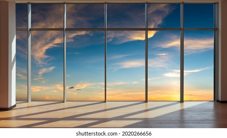 Through the floor-to-ceiling windows, the outdoor sky and cloudscape