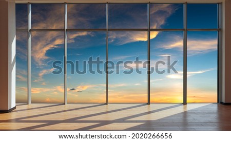 Through the floor-to-ceiling windows, the outdoor sky and cloudscape