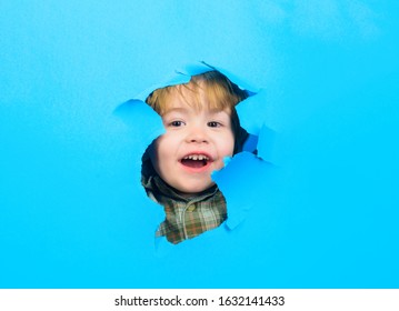 Through Paper. Happy Boy Looking Through Paper. Kid Looking Through Paper. Boy Breaks Paper. Sale And Discount. Online Shopping. Logo. Advertising. Breaking Wall. Smile.