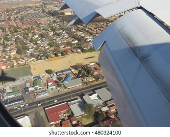 Through a plane window.