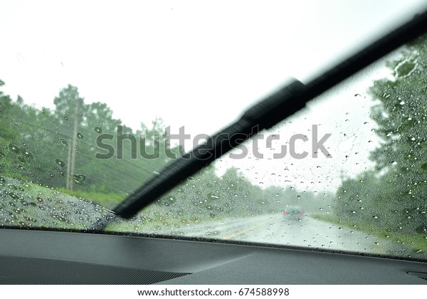 Through the\
Windshield (Driving in the\
Rain)