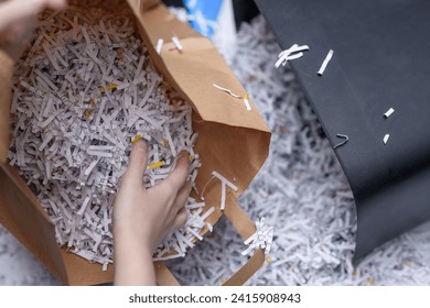 Throw away scattered, damaged, shredded papers, segregate garbage and place waste paper in a paper bag