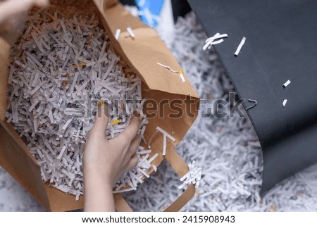 Throw away scattered, damaged, shredded papers, segregate garbage and place waste paper in a paper bag