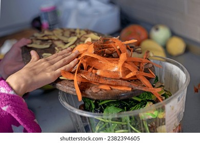 Throw carrot and potato skins into the trash. waste sorting - Powered by Shutterstock