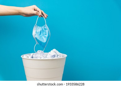 Throw the mask into the trash, bottom view. Find the mask from the trash. Coronavirus go away. Throw down the coranovirus