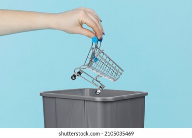 Throw Supermarket Trolley Into Trash Bin, Trolley In Hand In Front Of Trash Can, Online Shopping Concept, Do Not Go To Stores And Supermarkets