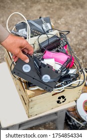 Throw A VHS Cassette Into An E-waste Box