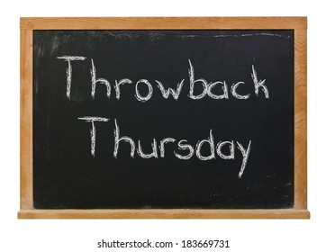 Throwback Thursday hand written in white chalk on a black chalkboard isolated on white
