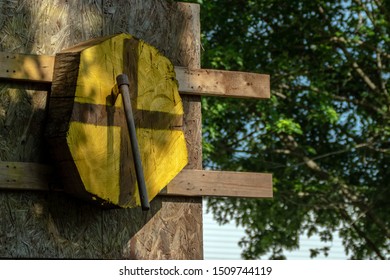 The Thrower Hit The Target During A Friendly Tomahawk Throwing Competition. Bokeh.