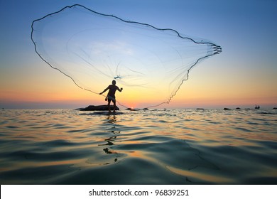 Throwing Fishing Net During Sunrise