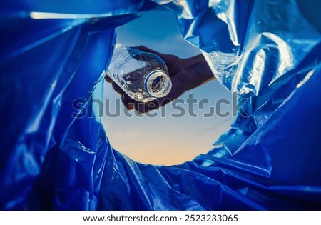 Throwing plastic bottle. Hand throwing bottle in trash cans. Throwing glass in trash bin. Waste sorting for Recycling. Empty glass bottles in trash bin container. Garbage Sorting. Trash bin bucket.